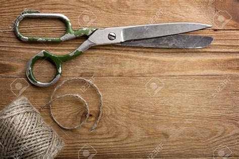 13808768 Old Scissors On The Wooden Table Stock Photo Savvy That
