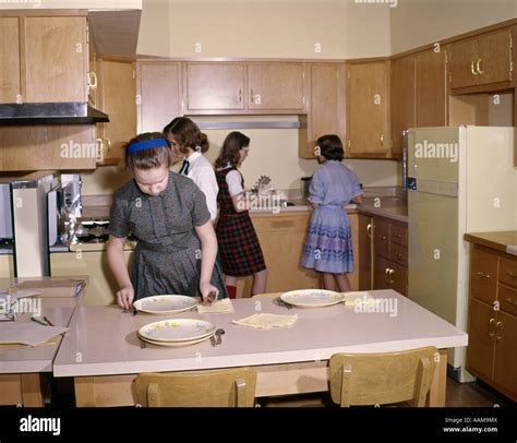 1960 1960s 4 Girls Students In Kitchen Home Economics Class Setting