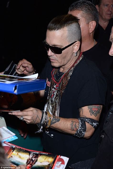 Johnny Depp Puffs On A Cigarette As He Steps Out In Poland Daily Mail Online