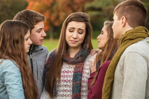 Friends Comforting Crying Girl Stock Photo Image Of Outdoors Friend
