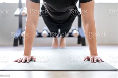 Asian Woman Doing Push Ups In A Training Gym Stock Image Everypixel