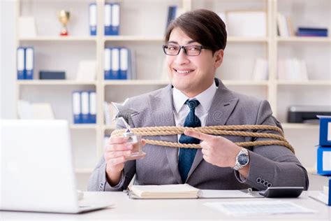 The Businessman Tied Up With Rope In Office Stock Photo Image Of