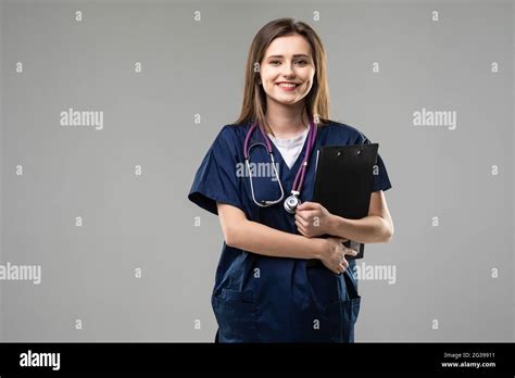 Photo Of Serious Doctor Lady Hold Clipboard Pen Write Wear Stethoscope Specs White Uniform