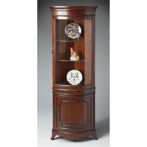 We feature ready to assemble and custom made items. Butler Corner Curio Cabinet - Plantation Cherry at Hayneedle