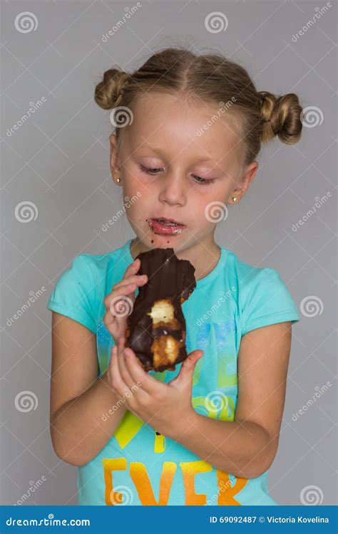 the girl with two plaits biting a chocolate cake stock image image of face donut 69092487
