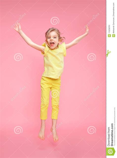 Excited Girl Jumping In Studio Stock Image Image Of Excited Happy