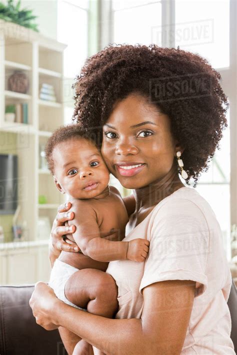Black Mother Holding Baby Son Stock Photo Dissolve