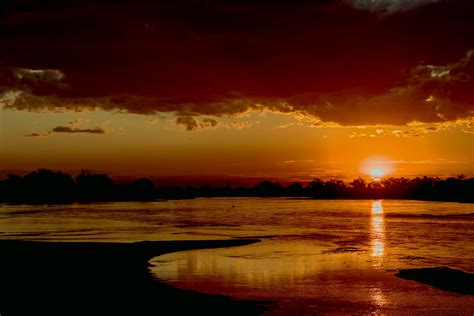 Sunset Over The Luangwa River Zambia 4k Wallpaper Zambia Travel