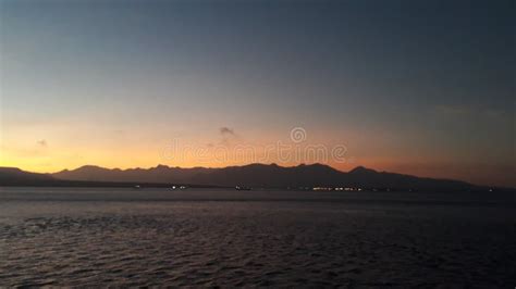 Mountain View At Sunrise In The Morning Seen From The Sea Stock Photo