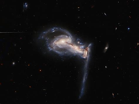 Hubble Captures Stunning Gravitational Interaction Between A Trio Of
