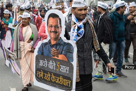 Image Of Aam Aadmi Party Aap Supporter Holding Cutout Of Arvind