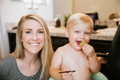 Adorably Precious Cute Little Blond Toddler Boy Showing Off His New