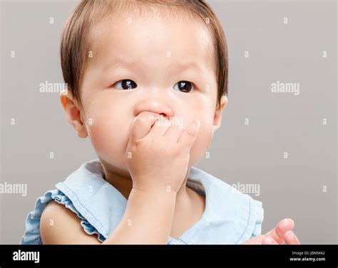 Baby Girl Sucking Her Finger Into Mouth Stock Photo Alamy