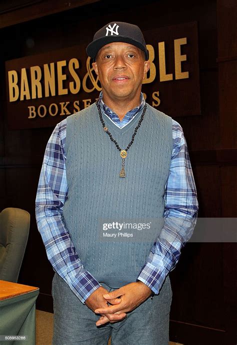 Russell Simmons Signs His Book The Happy Vegan A Guide To Living A