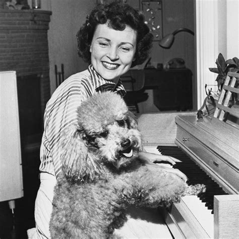 23 Pictures Of Betty White With Puppies To Brighten Your Day News And