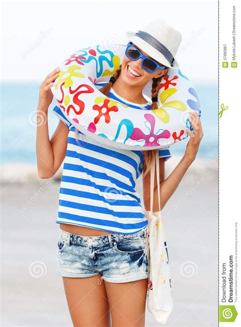 Beach Woman Happy And Colorful Wearing Sunglasses And Beach Hat Having