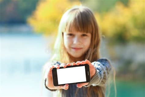 A Happy Child With Phone Taking Selfie In Nature In The Park Travel