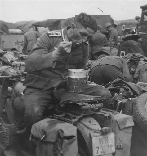 Maybe you would like to learn more about one of these? Photo German soldier eating a meal in the field atop a ...