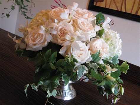 Low Lush Arrangement Of Whites And Greens In Silver Pedestal Container
