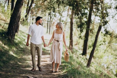 Free Photo Young Couple Having A Walk In The Woods