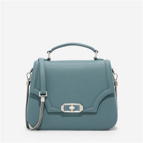 Charles and keith boxy sling bag with bow. CHARLES & KEITH - Bags. Teal mid-sized single top handle ...