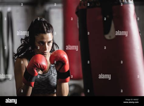 Female Boxer Practicing Boxing With Punching Bag Stock Photo Alamy
