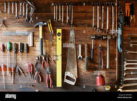 Work Tools Hanging On Wooden Board Stock Photo Alamy