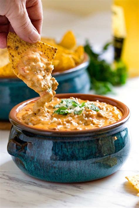 Melty cheese and hamburger and cooked with macaroni for a quick and easy weeknight dinner the whole family will like. Beef Queso Dip - keviniscooking.com