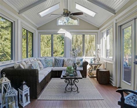 Sunroom With Wood Floor White Vaulted Ceiling Rattan Sofa With White