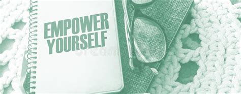 Empower Yourself Words On Book Cover With Eyeglasses And Pen Business