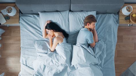 Quarrelling Young Couple In The Bed Young People Lying Turned Away From