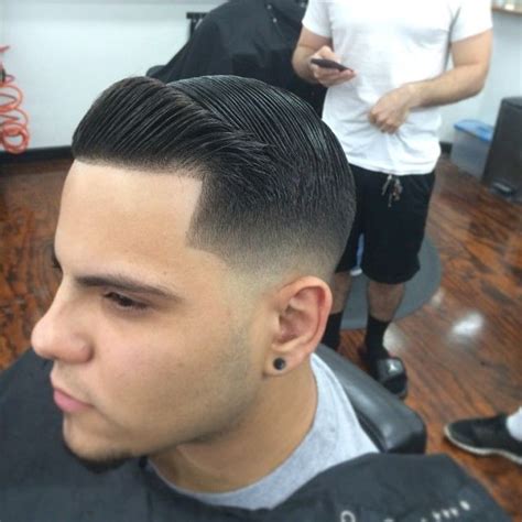 This has been a perpetual trend in men's haircuts for decades. Tight low fade with combover and crisp line-up | Men ...