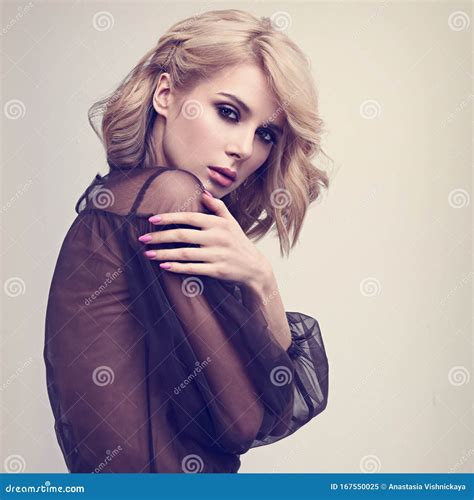 Alluring Blond Beautiful Woman With Curly Short Hair Style Posing In