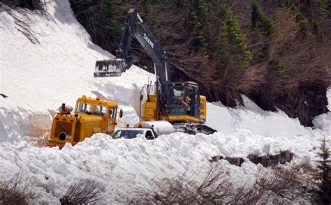 Plow Crews Begin Clearing Snow Drift On Glacier National Park Road