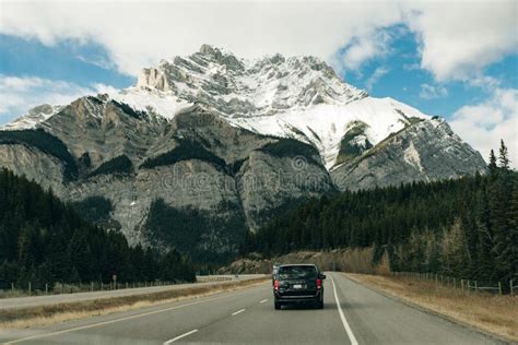 Road Through The Canadian Rockies Surrounded With Rocky Mountains