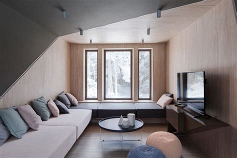 Asymmetrical Living Room That Balances The Seating And Pillows With The