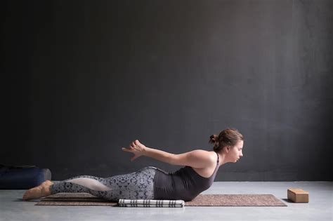 Premium Photo Sporty Woman Practicing Yoga Doing Salabhasana Pose