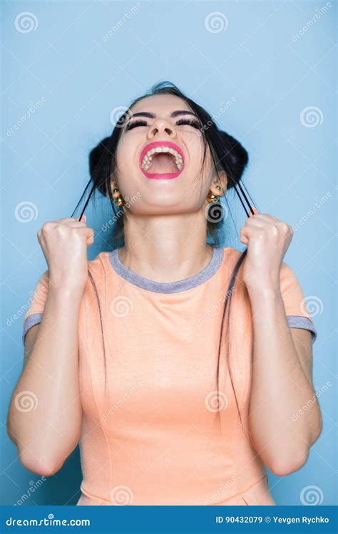 Furious And Frustrated Woman Screaming On Blue Background Girl Cries