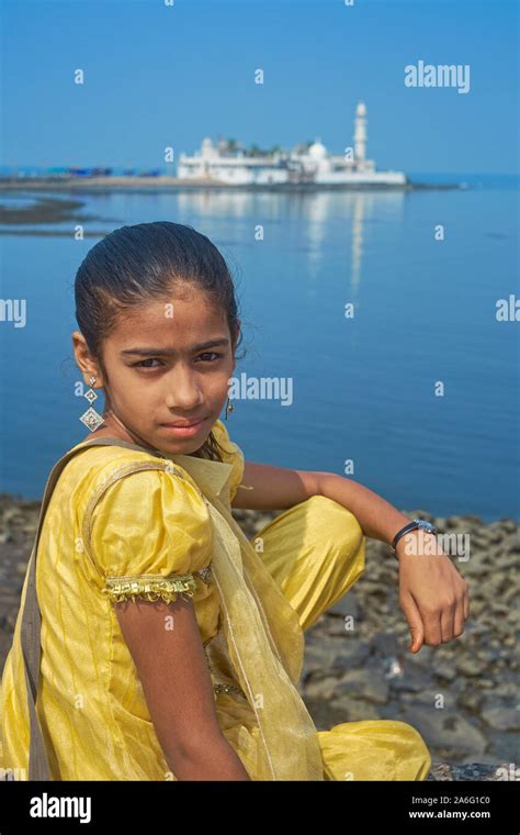 A Young Indian Girl In Traditional Dress Sitting By Worli Bay Mumbai