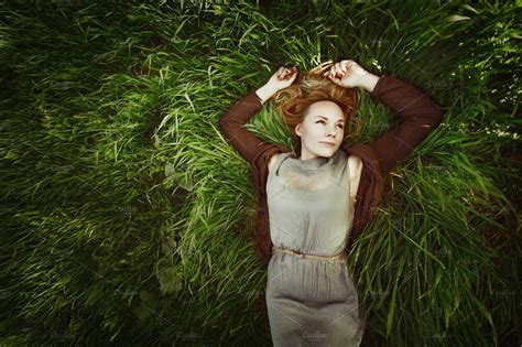 Young Woman Lying In The Grass High Quality People Images ~ Creative