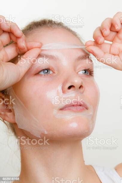 Woman Removing Facial Peel Off Mask Stock Photo Download Image Now