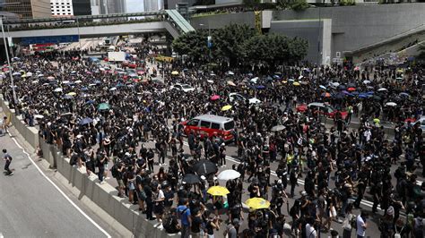 Protesters In Hong Kong Block Road And Surround Police Headquarters