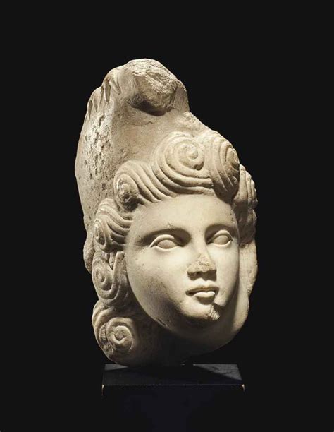 A Roman Marble Head Of A Youth Circa Late 1st Early 2nd Century Ad