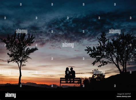 Silhouette Couple Sitting Bench Sunset Bench Hi Res Stock Photography