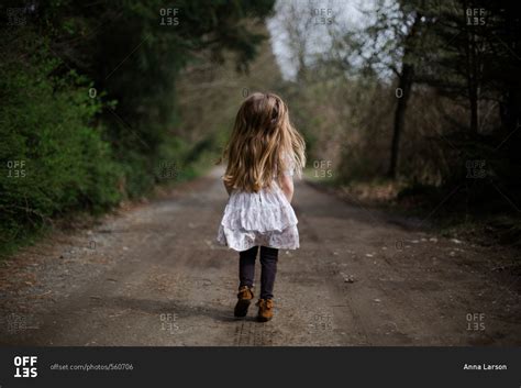 Girl Walking Away Down Rural Path Stock Photo Offset