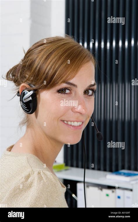 A Woman Wearing A Telephone Headset Stock Photo Alamy