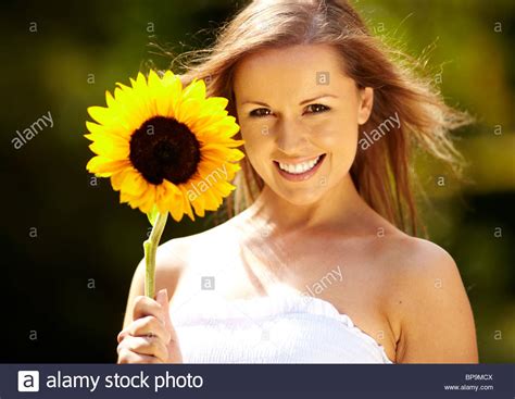 Pretty Girl Holding Sunflower Stock Photo Alamy