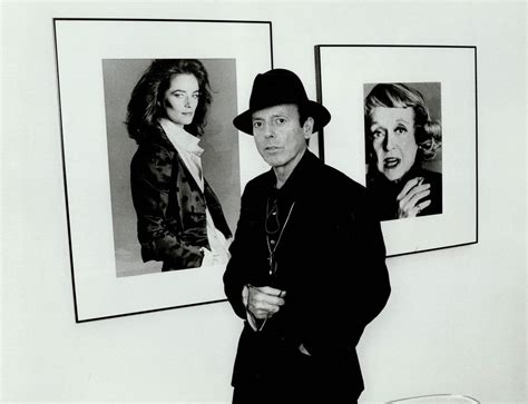 francesco scavullo celebrity photographer stands in front of his portraits of charlotte