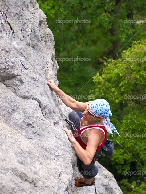 Climbing Man On High Rocks — Stock Photo © Biletskiye 22849924