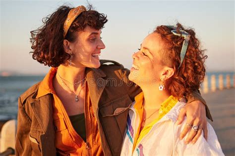 Lesbian Lgbtq And Couple Of Friends At The Beach With Love Hug And Excited For Summer Holiday
